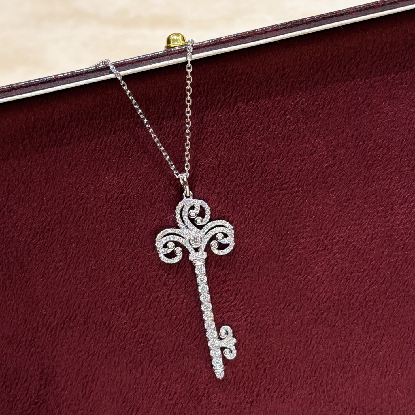 Tiffany & Co Elegant Silver Key Pendant with Diamonds